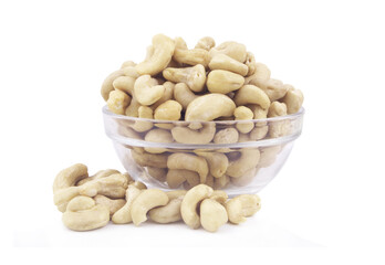 Cashew nuts in glass bowl isolated on white background 