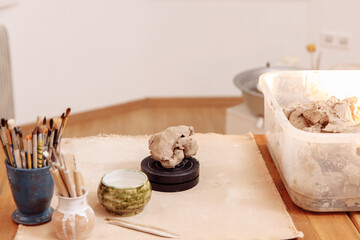 DIY Creating a Cup from clay by hand molding. Step 1. Take the clay. High quality photo