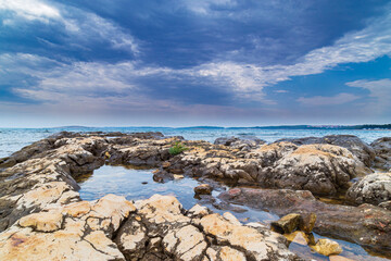 Fototapeta na wymiar Beautiful rock formations along the Adriatic Sea coast in summer