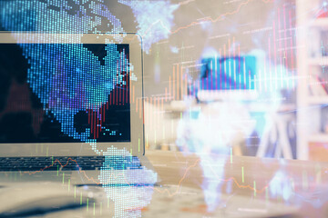 Forex market chart hologram and personal computer background. Multi exposure. Concept of investment.