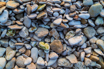 Rock formations on the Adriatic Sea in summer, under warm evening light