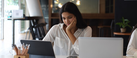 Attractive businesswoman concentrate on new work