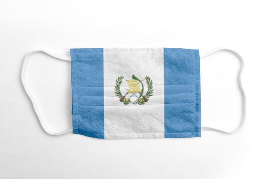 Mascarilla Cubreboca Con Bandera De Guatemala Impresa, Sobre Fondo Blanco, Aislada.