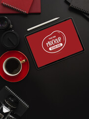 Workspace with mock up tablet with coffee cup and copy space on table