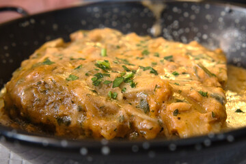 A piece of delicious Italian lasagna in rich fish sauce