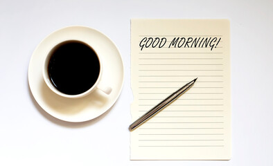 GOOD MORNING - white paper with pen and coffee on white background
