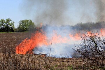 Fire in a Kansas farm field west of Hutchinson Kansas USA out in the country.