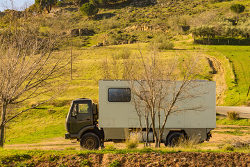 Offroad camper 4x4, rv motor home on nature © Voyagerix