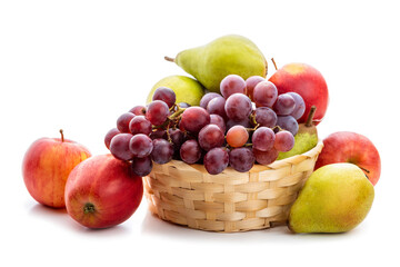 Naklejka na ściany i meble Ripe fruits apples, pears and grapes in a wicker basket. Isolate on white background
