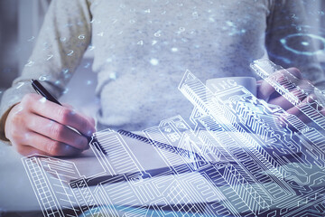 IOT drawing over writing hands in notepad background. Concept of smart home. Multi exposure