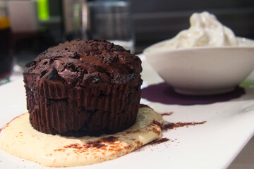 Chocolate brownie cake with vanilla ice-cream and melted dark chocolate topping 