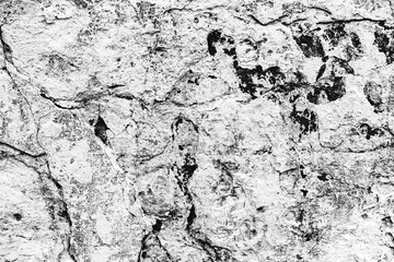 Texture of a concrete wall with cracks and scratches which can be used as a background