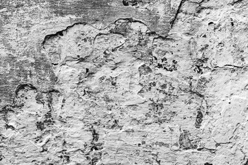 Texture of a concrete wall with cracks and scratches which can be used as a background