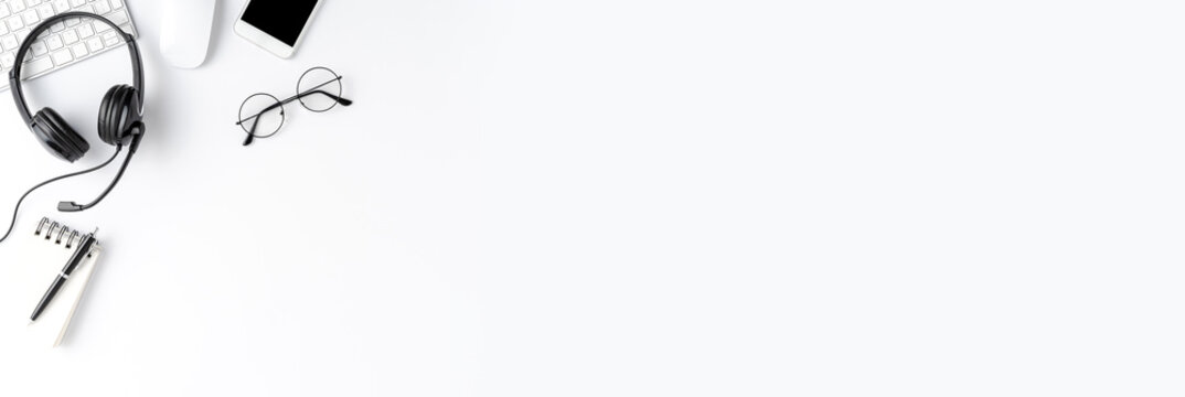 Call center desktop with headset and accessories. Customer service concept. Banner