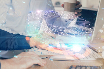 Double exposure of technology hologram with man working on computer background. Concept of big data.