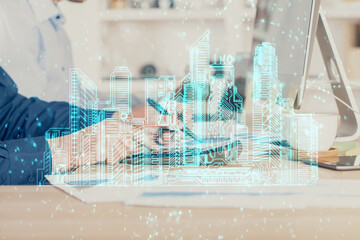 High tech city drawing with businessman working on computer on background. Smartcity concept. Double exposure.