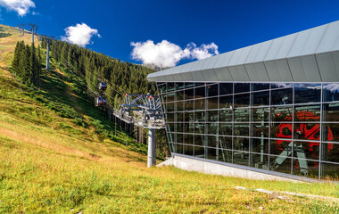 DEMANOVSKA DOLINA, SLOVAKIA - AUGUST 24, 2020: Station of ropeway Funitel in resort Jasna in Low Tatras mountains © Jaroslav Moravcik