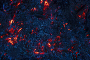 background of red burning coals in the night