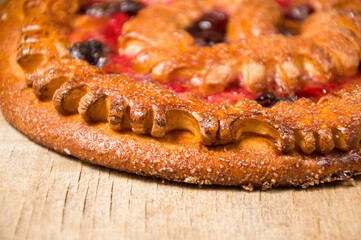 Cherry pie on a rustic wooden table. Fresh bakery. Homemade sourdough bakery. Selective focus.