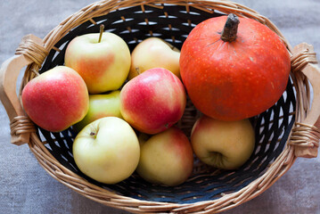 Pumpkin and apples in a basket