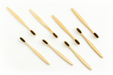 Eco materials concept with bamboo tooth brush on white background top view copy space