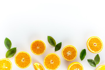 Orange slices on white background top view copy space