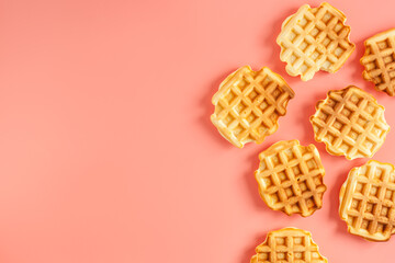 Traditional belgian waffles on pink background top view mockup