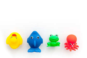The concept of children’s bath toys. White background top view copyspace