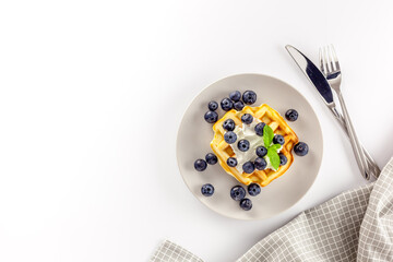 Homemade belgian waffles on served table on white background top view mockup