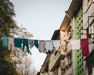 Multi-colored linen high on a rope. The comfort of a residential area
