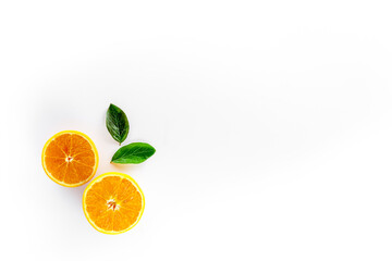 Orange slices on white background top view copy space