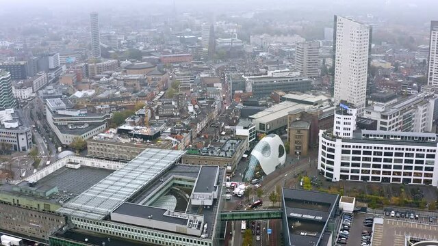Eindhoven city aerial view in the Netherlands. Flying over above the city center ft. central town buildings and streets in Holland, Europe 