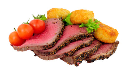 Sliced roasted pepper and salt covered beef rump beef with tomatoes and potato rosti isolated on a...