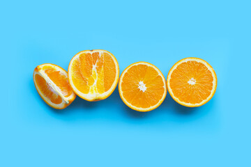 High vitamin C, Juicy and sweet. Fresh orange fruit  on blue background.