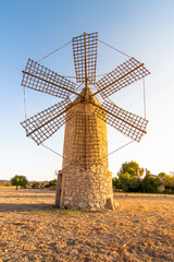 Fototapeta na wymiar Old restored windmill in the rural area of Majorca island, Spain. Majorca countryside