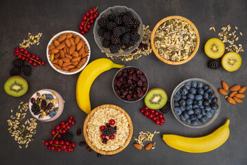 Group Fruits Breakfast with bread Whole grains and nuts, yogurt mix with Cherry , banana, avocado in the wooden table. Breakfast for Health and Diet concept