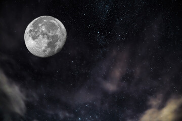 full moon with stars and nebula