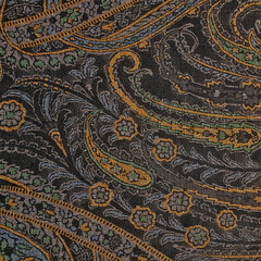 Dark ceramic tile with floral pattern for wall and floor decoration. Concrete stone surface background. Vintage texture with ornament for interior design.