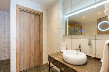 Interior of a hotel bathroom interior with shower cabin