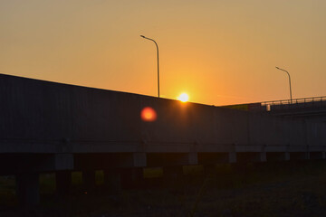 Fototapeta na wymiar the sun rises across the freeway