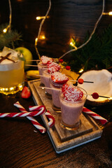 Winter shot cocktails with strawberry on the table in restaurant