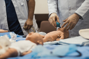 Resuscitation of the newborn. Students practice. Simulation