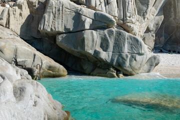 Marvelous rocks on a Island in the Aegean Sea with blue water