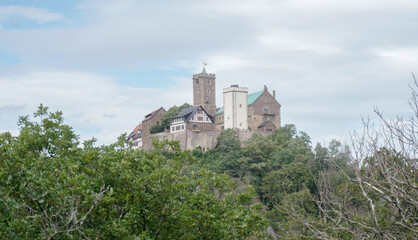 Fototapeta na wymiar Wartburg Castle near Eisenach on the Hochrhöner hiking trail in Hessen, Germany.