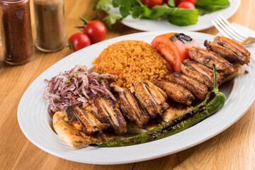 Turkish cuisine chicken wings grill. Grilled chicken wings on wooden background