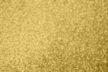 Abstract blur gold glitter sparkle defocused bokeh light background