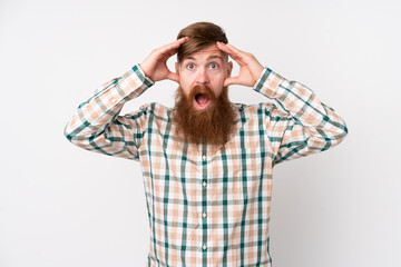 Redhead man with long beard over isolated white background with surprise expression