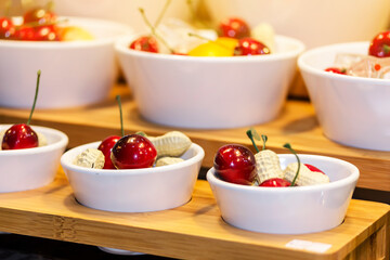 colorful imitate various types of fruit in white cup on shelf for advertising or marketing