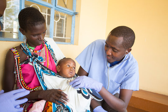 Doctors working with children in clinic. Kenya. Africa.