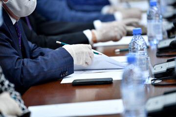 Fototapeta premium business, hand, businessman, office, pen, people, document, writing, meeting, paper, contract, corporate, job, working, businesswoman, person, work, table, closeup, computer, human, desk, professional